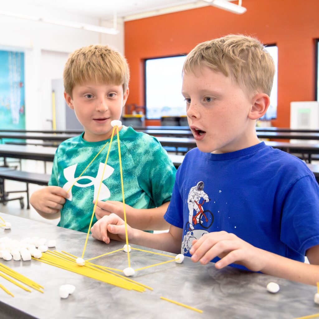 Two kids playing and learning at YMCA childcare